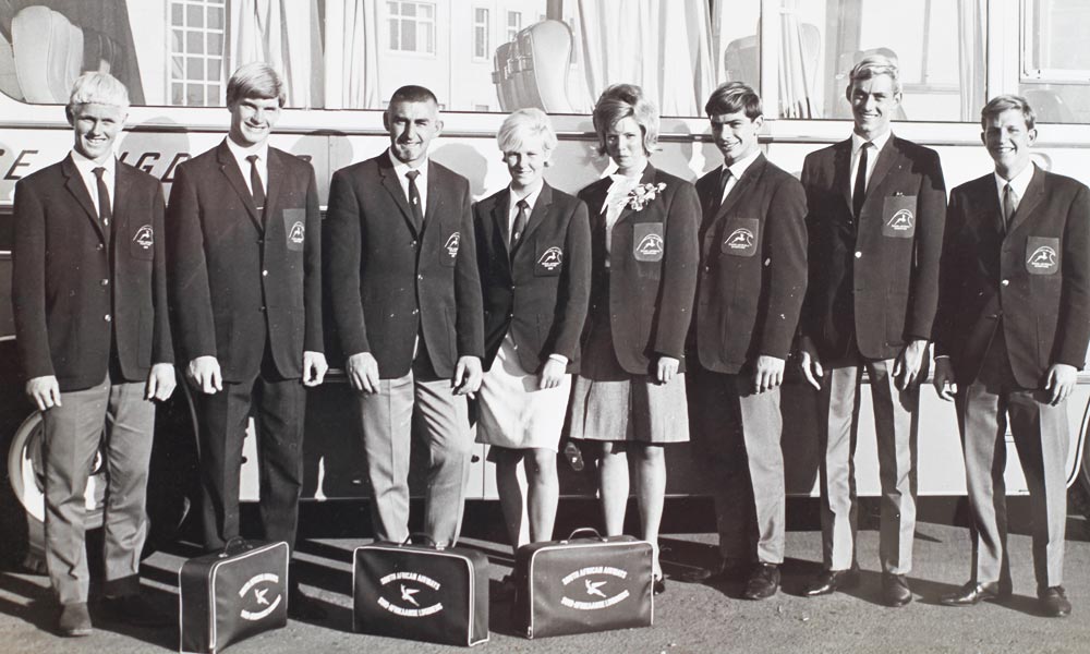 John with the 1966 Springbok surfing team. From left to right, Donald Paarman, Robert MacWade, John Whitmore, Margaret Smith, Marlene Webb, Errol Hickman, Cornel Barnett. Image Whitmore Collection.